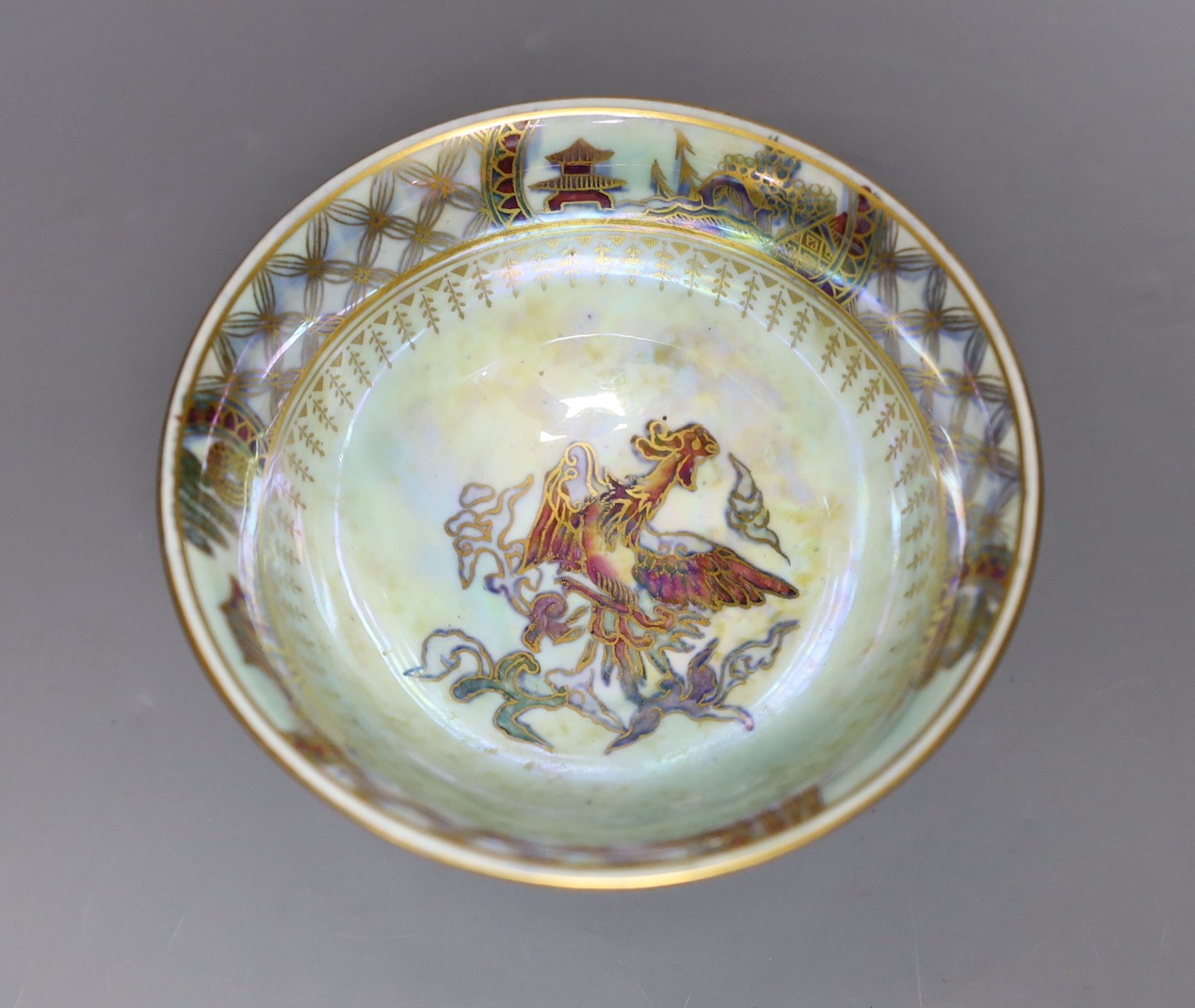 A Wedgwood blue lustre chinoiserie pedestal bowl, designed by Daisy Makeig Jones, pattern number Z4829, 8 cms high